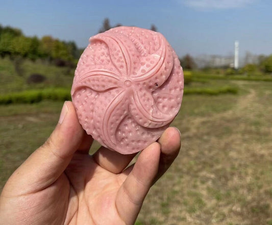 Pink opal star fish carving